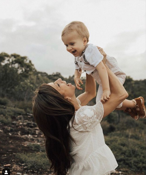 Mom holding her kid, mommy playing and dancing with a baby