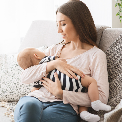 Mom singing to a baby while he is sleeping