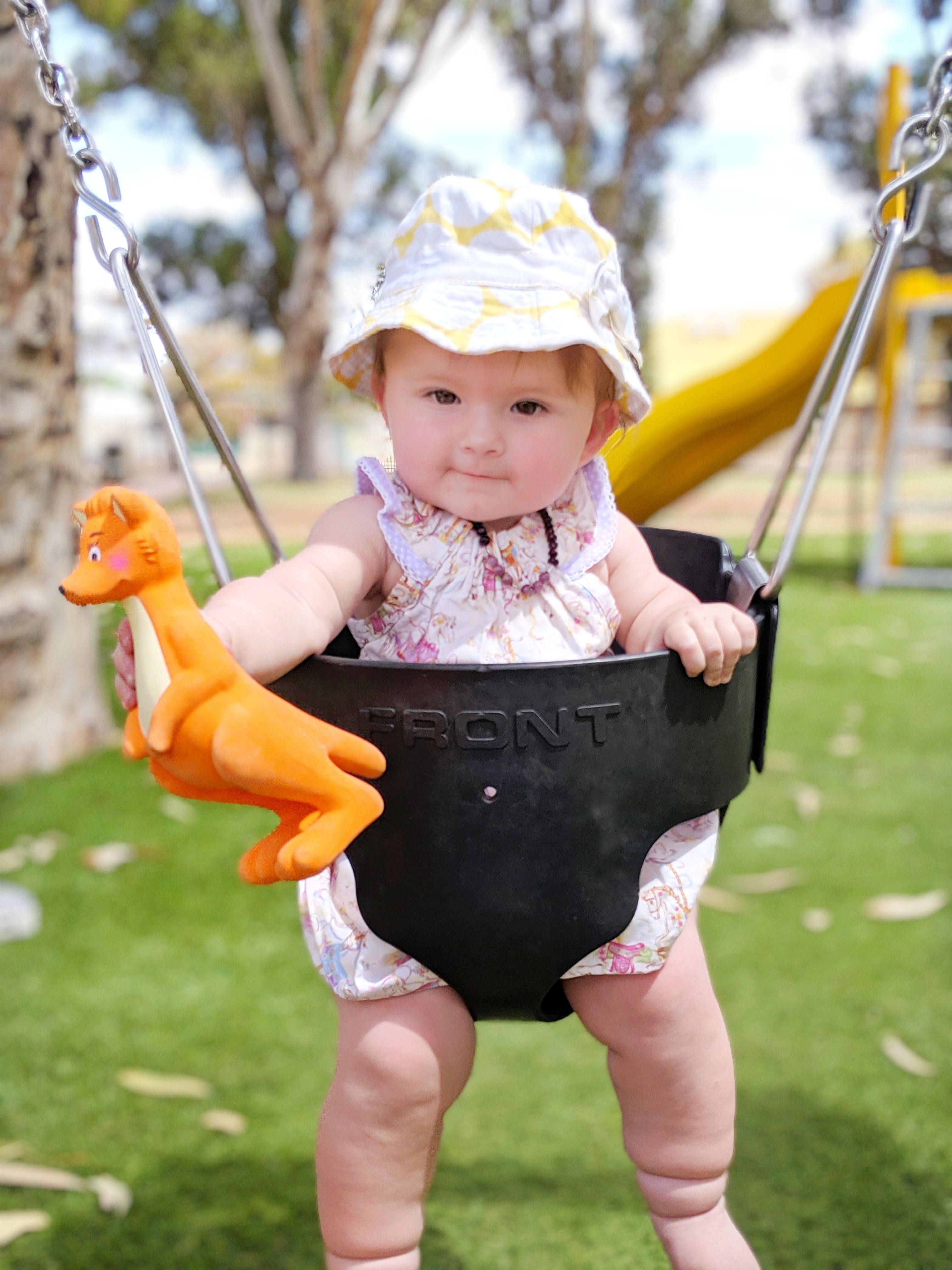 Baby playing in the park with Mizzie