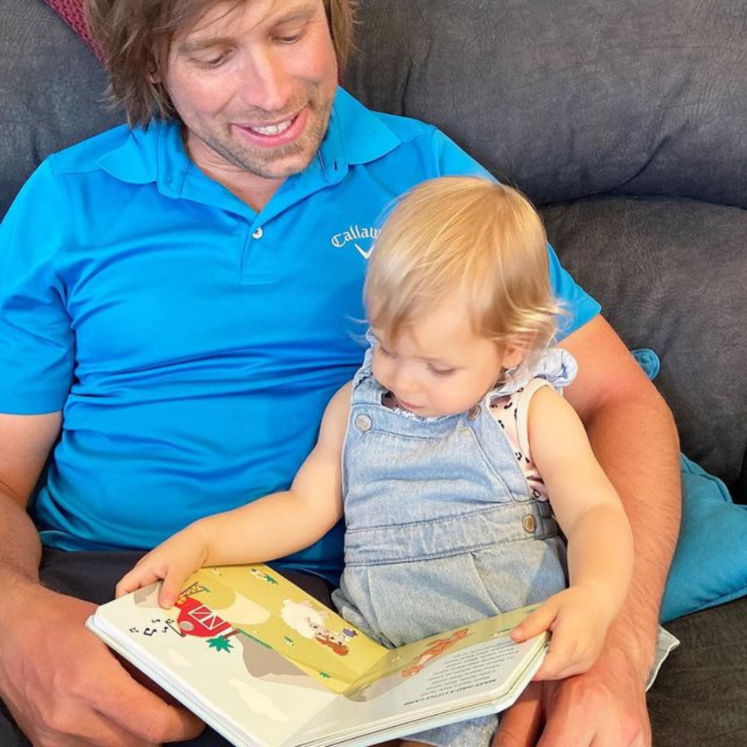 Dad enjoying a reading time with his kid